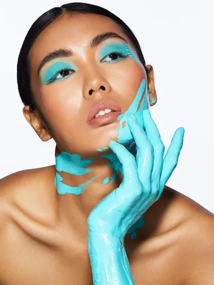 A turquoise takeover! This creative look uses face paint to create a dripping, artistic effect that is both bold and beautiful.