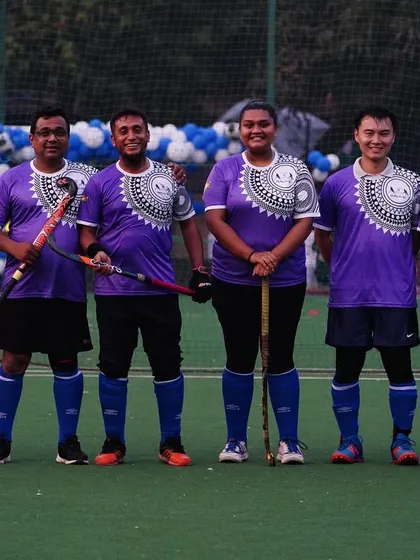 Our team in purple jerseys, ready to compete. We participate in various events to give our players diverse competitive experiences.