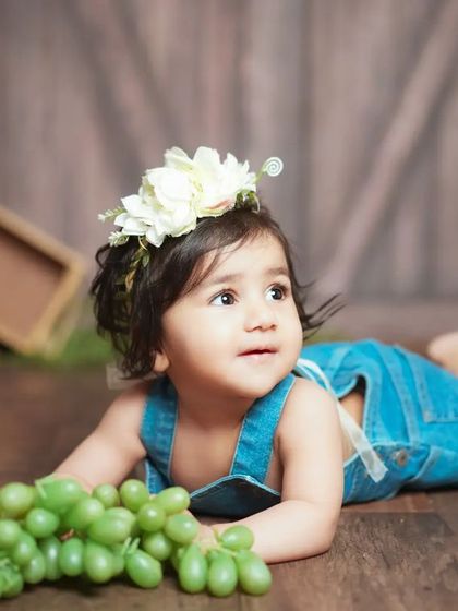 A sweet pose from our rustic-themed shoot. The combination of wood textures and soft florals creates a beautiful contrast.