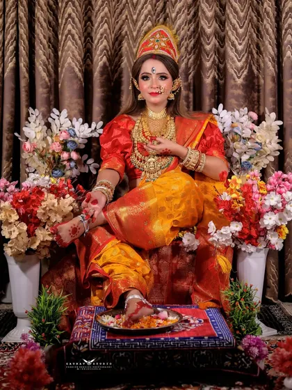 A full-length shot showing the complete goddess look, with traditional alta on her feet.