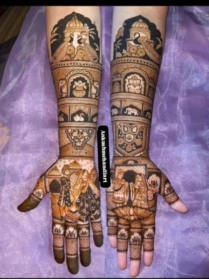 A grand and intricate design featuring wedding portraits, a lotus motif, and various traditional symbols, perfect for a royal bridal look.