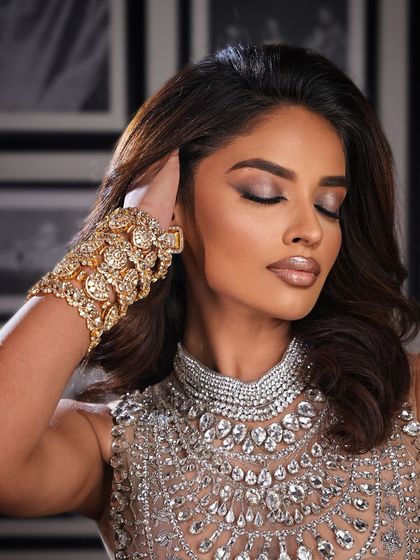 A soft, shimmery eye and glossy nude lip for this glamorous evening look, dripping in diamonds.