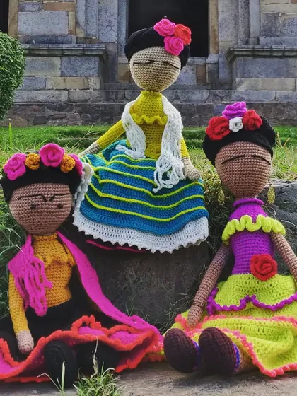 My superstar Frida dolls sitting together. Each one has a unique, handmade dress and floral headdress, inspired by the iconic artist herself.
