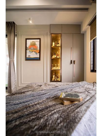 This parent's bedroom features a built-in display cabinet for showcasing collectibles. The warm lighting inside the cabinet adds a beautiful glow to the room in the evening.