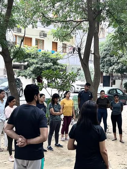 A group of students gathered outdoors for a practical Shatkarma session, learning ancient techniques for internal cleansing.