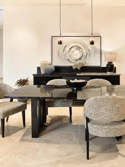The dining area is where family gathers. For our Terra project, we designed this custom marble-top dining table and upholstered Adira chairs to create a space that is both sophisticated and warm. It’s an example of how we build furniture that becomes the backdrop for everyday rituals and cherished stories.
