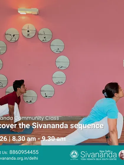 A student practices the lunge pose (Anjaneyasana) during a class focused on the Sivananda sequence. This posture is excellent for opening the hips and strengthening the legs.
