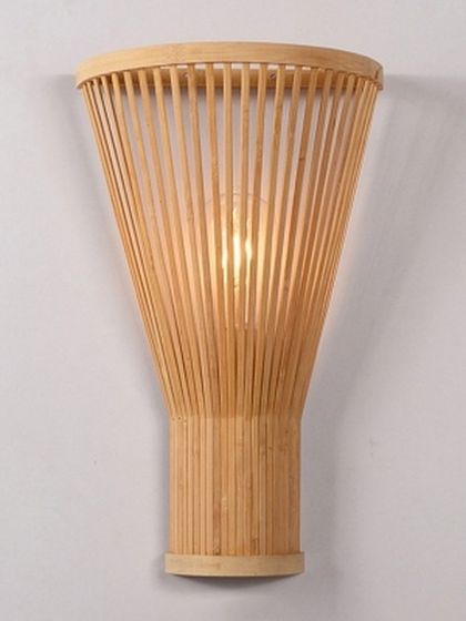 This minimalist wall sconce is crafted from vertical bamboo slats that form a gentle, tapered cone. The light emanates softly from within, making it a subtle yet elegant accent light for a modern or Scandinavian-inspired interior.
