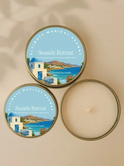 The 'Seaside Retreat' Mini Metal Charm, with a refreshing blend of eucalyptus, clove, and sea salt. The beautiful label art evokes a peaceful coastal escape.