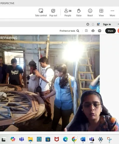 A screenshot from our virtual workshop on adaptive reuse, showing a live feed from a site where a wooden wheel is being repaired. Our digital workshops integrate real-time site visits to provide a tangible learning experience.