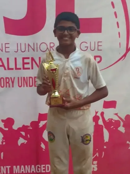 Parth Rane holding his trophy for his performance in the Thane Junior League Challenge Cup.