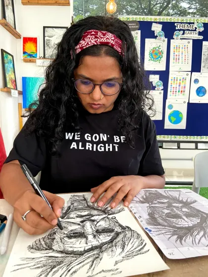 A student in our sketching course working on a detailed portrait. The focus and dedication of our students are truly inspiring.