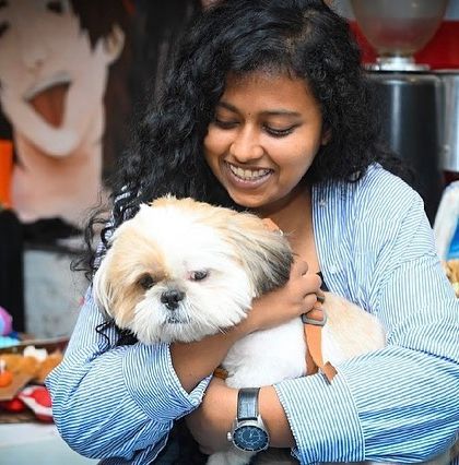 A guest enjoying a quiet cuddle with our fluffy boy, Tofu. He's a professional when it comes to snuggles.