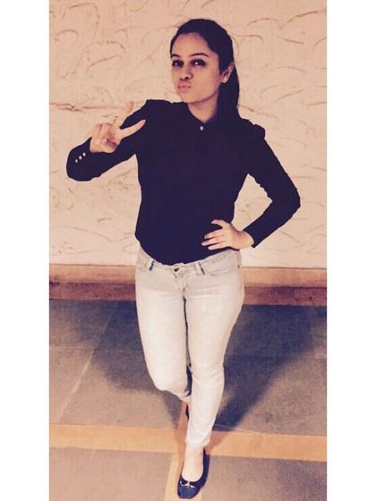 A simple, well-fitted dark blazer paired with light-wash jeans is a classic smart-casual combination. It's a versatile outfit that can take you from a casual office day to an evening out.