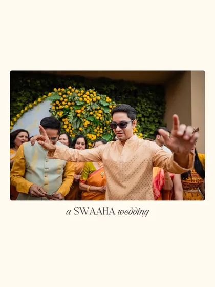 The joy of the celebration is infectious, as a guest dances against a backdrop of yellow flowers.