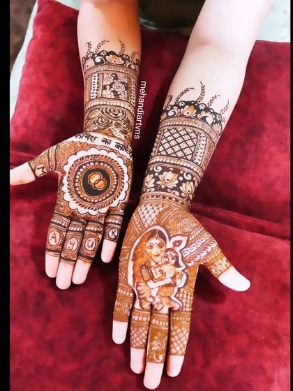 Mehandi for every family celebration. This unique design was created for a Karnchedan Sanskar (ear piercing ceremony), featuring a mother and child portrait.
