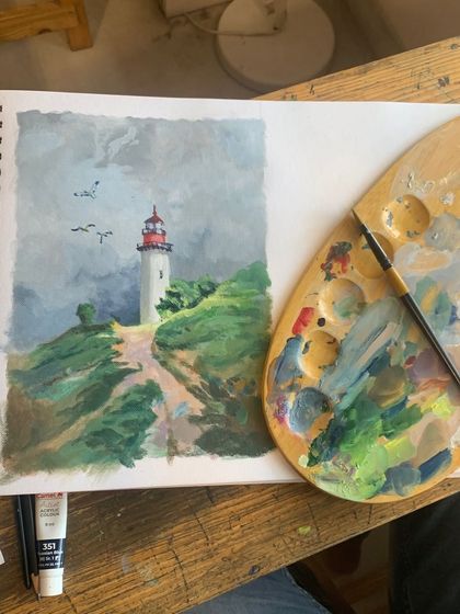 A guiding light in strokes of acrylic. This serene lighthouse painting by a student showcases their ability to blend colors and create a peaceful, atmospheric scene.