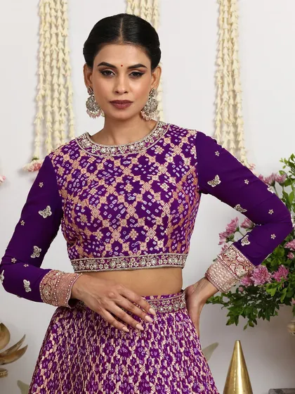 A close-up of the full-sleeved purple blouse, featuring delicate butterfly embroidery.
