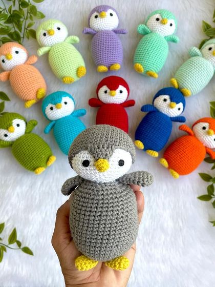 A rainbow of penguin babies! I made this colorful flock as return gifts for a birthday party. Each penguin is a different color, making them a unique and memorable party favor.
