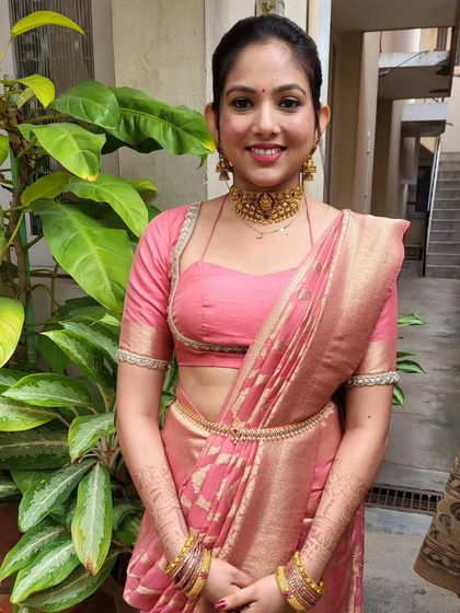 The client looks happy and confident in her modern body-hug drape. It's a stylish choice for young women attending weddings or parties.