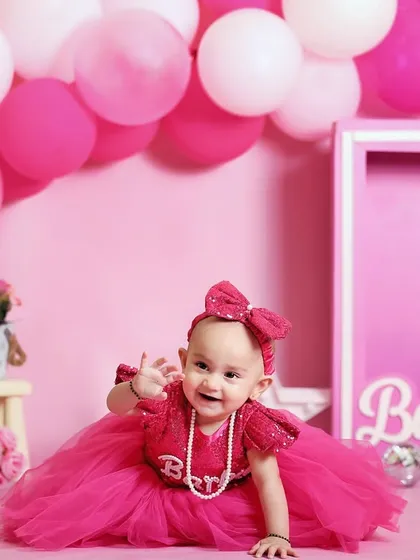 A happy wave from our little Barbie. This crawling shot captures her movement and joy within the perfectly pink Barbie-themed set.