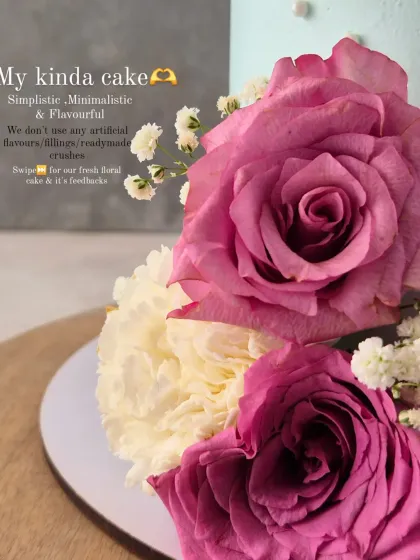 A close-up of the fresh roses on the pastel blue "Estate Social" cake. I love working with fresh flowers.