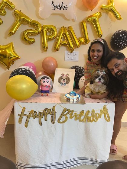 A beautiful family portrait with the birthday girl, Sushi. Celebrating with your pet is a moment of pure joy.