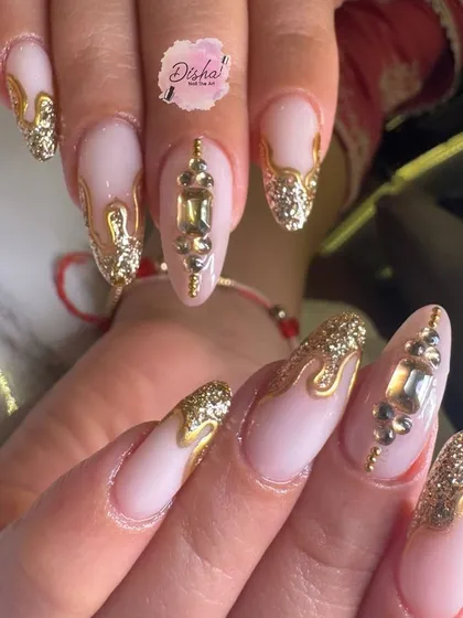 Dripping in gold. This Karwachauth special design features a milky pink base with cascading 3D gold drips and stunning jewel accents for a truly regal look.