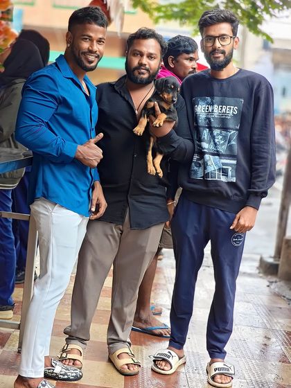 Me with two happy customers who just got their new Rottweiler puppy. I always ensure my customers are satisfied.