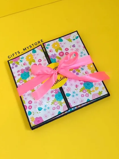 The finished birthday album, tied with a pretty pink ribbon.