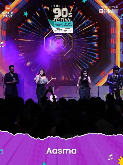 The four of us on stage, surrounded by incredible visuals at The 90s Festival. The production was top-notch, making our reunion show a truly spectacular event.