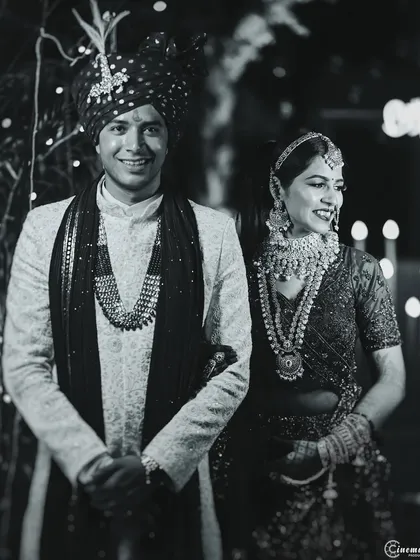 A happy, candid black and white portrait of the wedding couple. This style strips away distractions and focuses on their joyful connection.