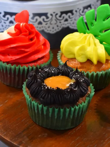 A trio of tempting cupcakes made by my students: rich Caramel Chocolate, classic Red Velvet, and tropical Pineapple.