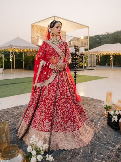 This look is all about bridal glory. The model is wearing a classic red lehenga, and I created a bold, defined makeup look to match its regal vibe.