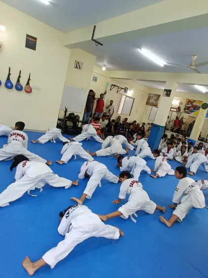 I guide my students through their stretches to ensure they use proper technique and get the most out of their conditioning.