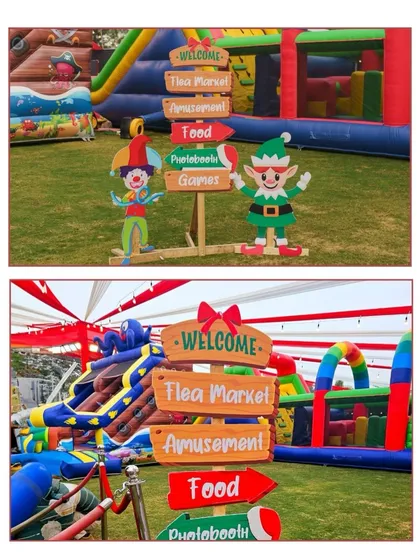 Fun directional signposts are a great way to guide guests and add to the theme. These signs for a Christmas carnival point the way to the flea market, amusement rides, food, and games.