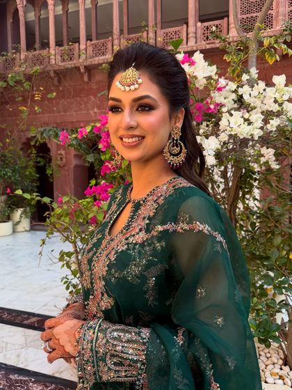 A smiling portrait that captures the joy of the mehendi ceremony. The makeup is fresh, radiant, and designed to last through the festivities.