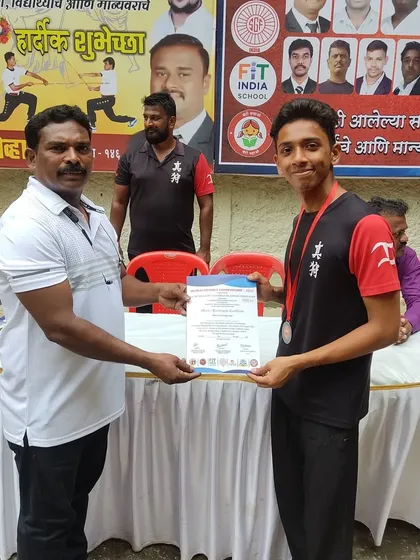 A proud moment for one of my students, receiving his certificate and medal at the Silambam championship. More than medals, it was a great experience.