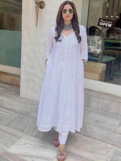 The lovely actress Gungun enjoying her visit to the salon. Here she is outside, showing off her freshly styled hair with soft, elegant waves.