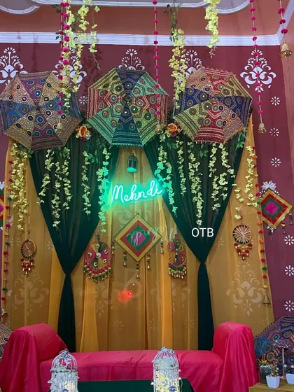 Here is a similar setup with a 'Mehendi' neon sign. I can customize the signs and colors to perfectly match your event's theme.