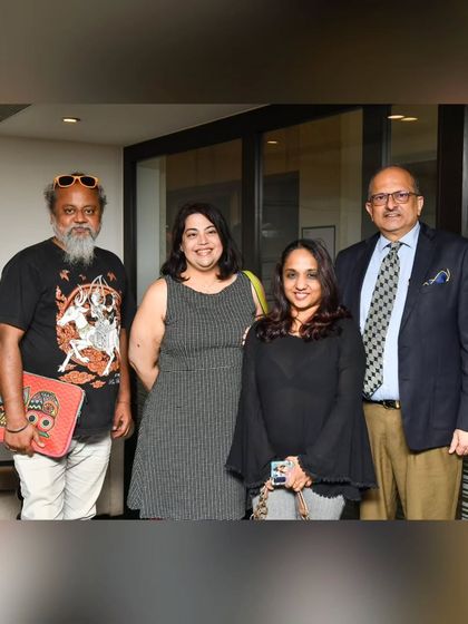 A group of esteemed guests, including food critics and influencers, pose for a photo at our FTR-Vinyl Bar collaboration. We are a hub for the city's culinary community.