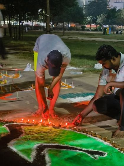 Teamwork in action as we prepare our athletics-themed Diwali decorations.