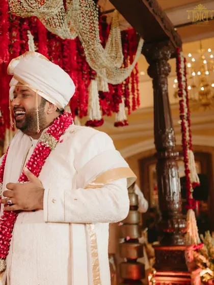 The groom's laughter fills the air during the traditional Marathi wedding. Our design focused on creating a space that felt joyous and authentic, allowing the couple and their families to fully immerse themselves in the celebration.