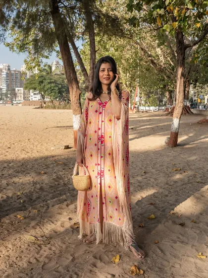 A breezy, beautiful kaftan for a day at the beach. This look is all about comfort and effortless style, perfect for a destination wedding welcome lunch.