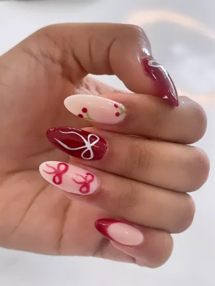 A cute and festive design in deep red and sheer pink, featuring hand-painted bows and holly berries.