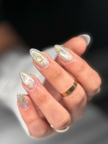 A closer view of the gold celestial nail art. The delicate, hand-painted details are what make this set so special and ethereal.
