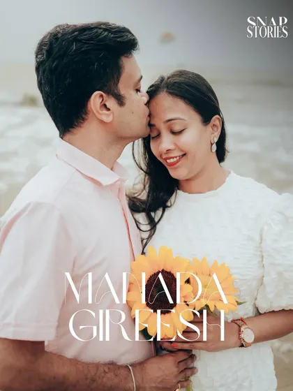 A beautiful close-up portrait of the couple, highlighting their happy expressions and the lovely sunflowers from their casual beach pre-wedding session.