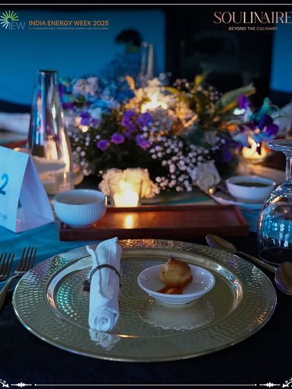 A close-up of the elegant gold-plated dinner setting at India Energy Week. Every element of our service is curated for a sophisticated and memorable dining experience.