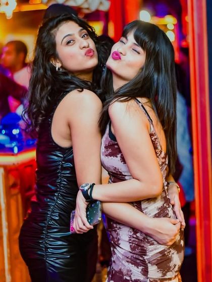 Pout game strong at the club. Just a couple of friends having a great time and posing for the camera during my set.