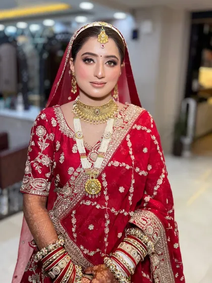 The bride looking serene and beautiful. This photo captures the soft, romantic feel of her overall look, from the makeup to the delicate jewellery.
